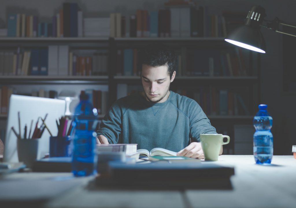 Teenager studying late at night